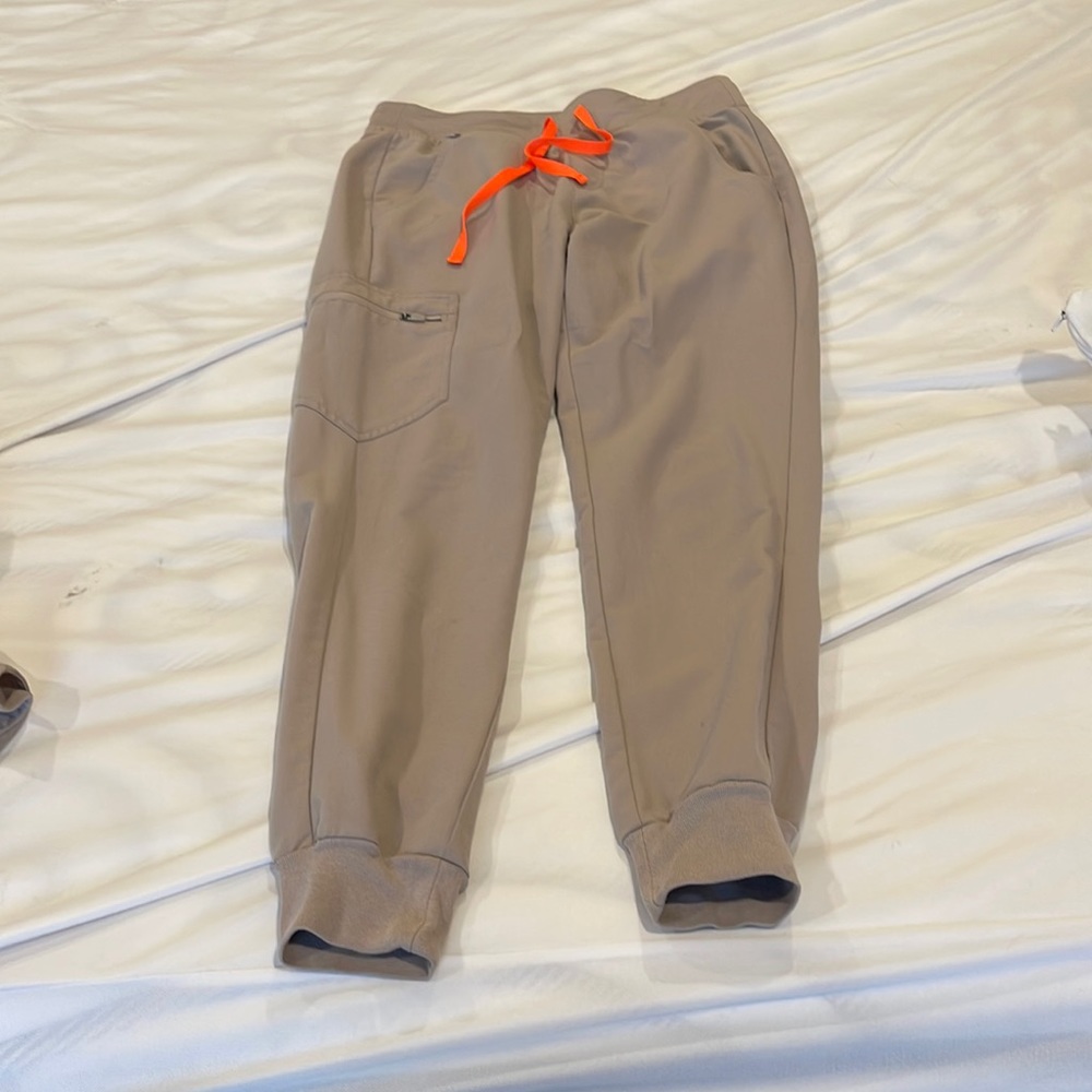 Figs x small set. Small pen stain on lower pant leg